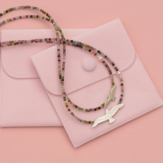 Big and Small Seagull Tourmaline Silver Necklace on pink pouch