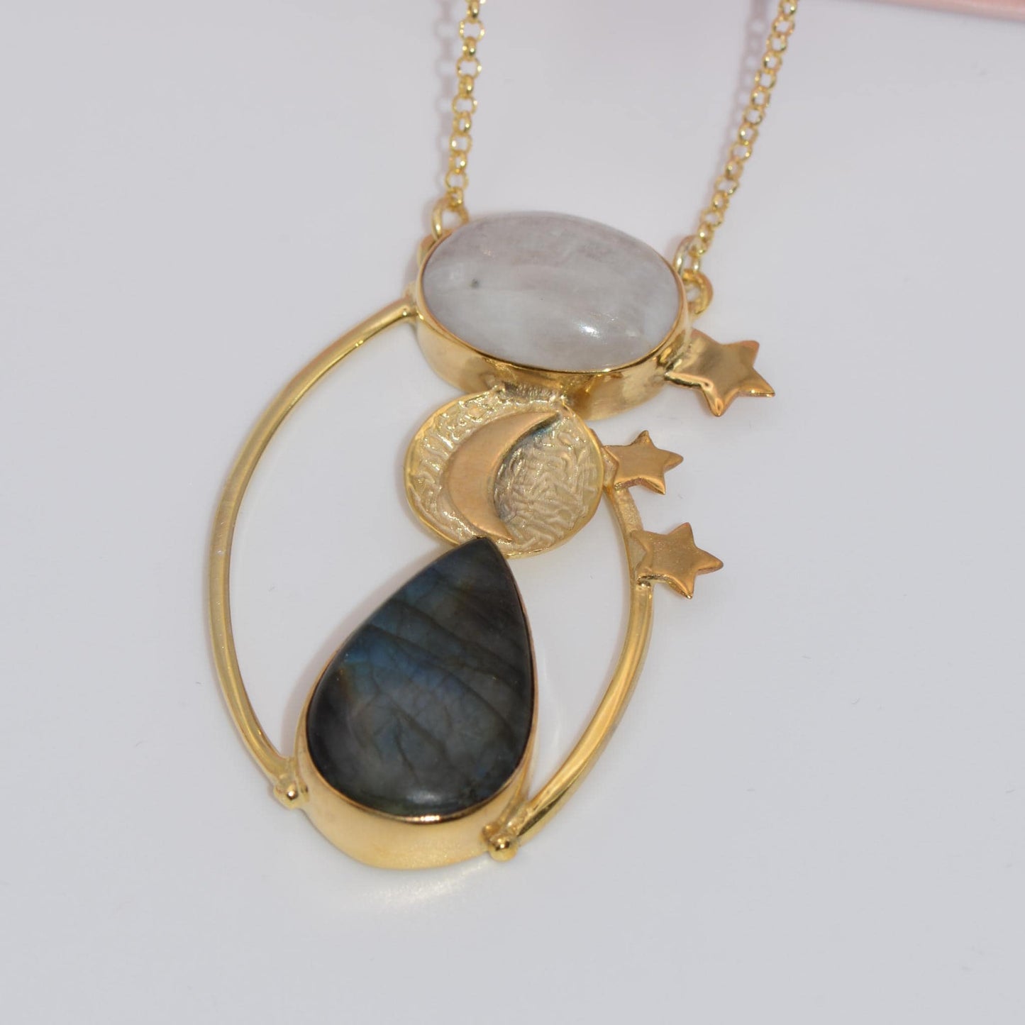 Day and Night Moonstone Silver Necklace with celestial motifs, featuring a moonstone and labradorite in silver and gold design.