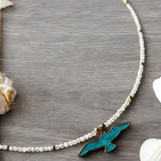 Istanbul Moonstone Seagull Necklace with a blue seagull pendant on a pearl beaded chain