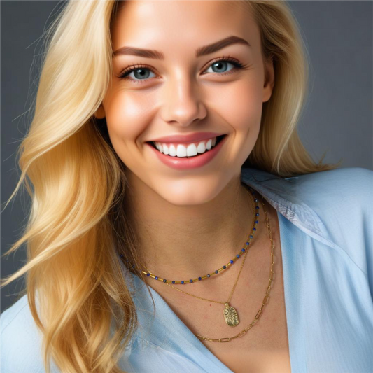Elegant Lapis Lazuli and silver pipe necklace, worn with a blue blouse, perfect for a chic and modern look.