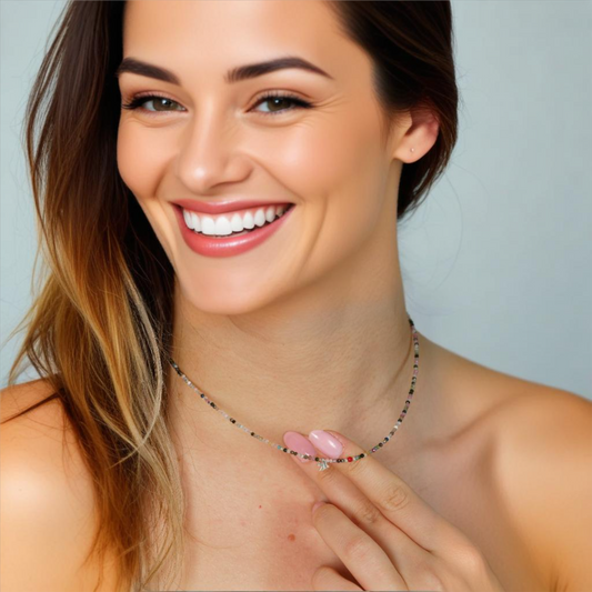 Minimal Carnelian Gemstone Necklace with Silver Bird Pendant showcased by smiling model.