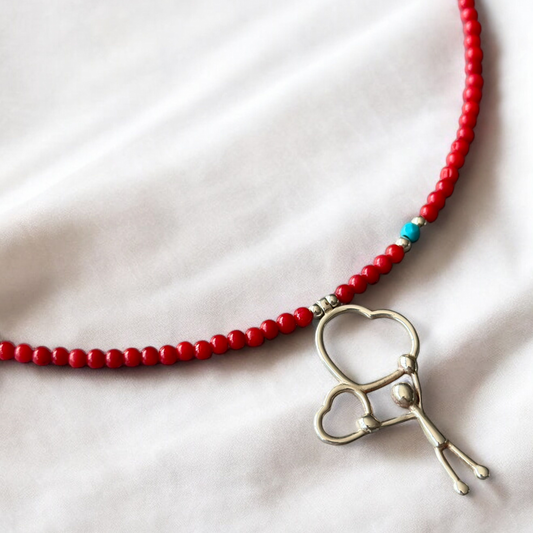 Two Hearts Coral Gemstone Necklace with red beads and a silver heart charm