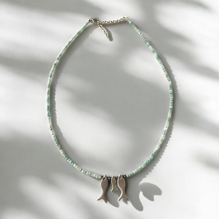 Amazonite gemstone necklace adorned with three silver fish pendants, beautifully designed for mothers with intent and love.
