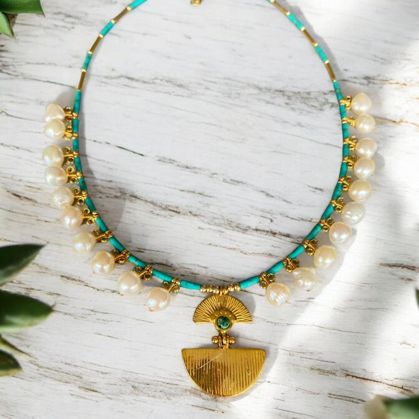 Ariadne Necklace with Pearl and Turquoise Gemstone in Sterling Silver 14K Gold Plated, featuring a gold pendant with a green gemstone on a white background.