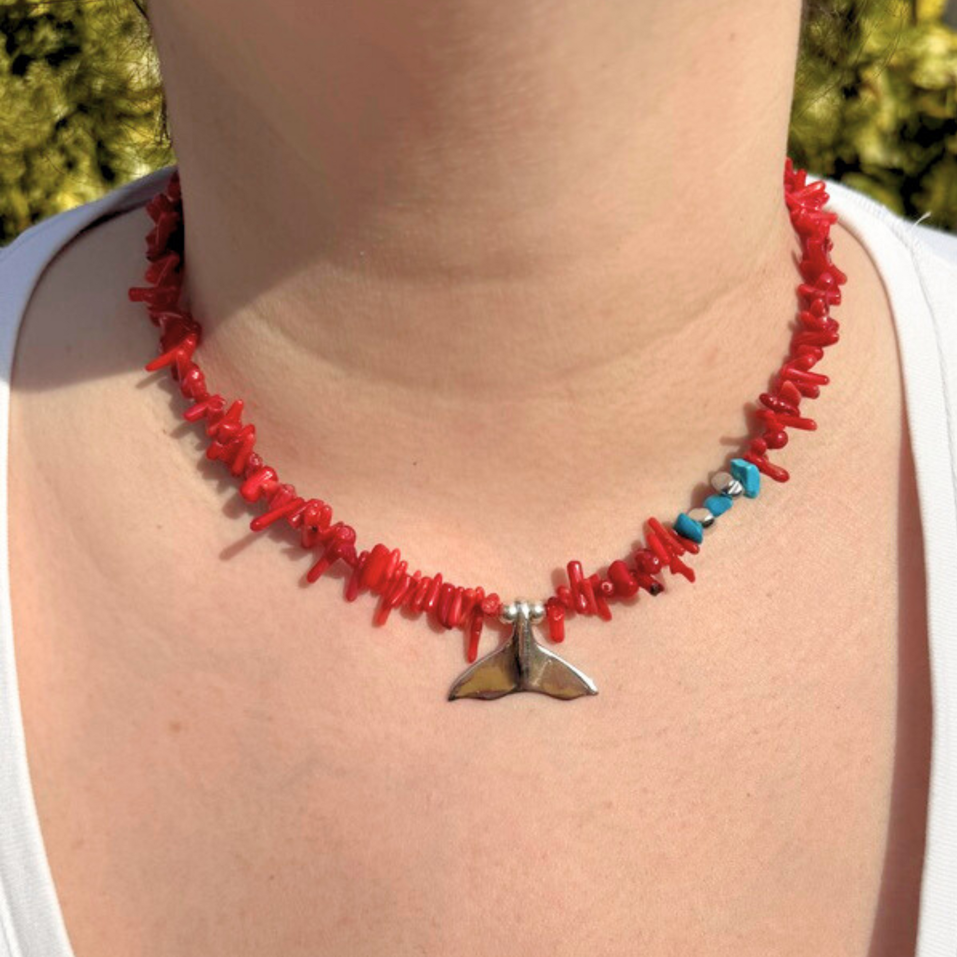 Coral starfish necklace handcrafted in 925 silver displayed on a person, showcasing its detailed and elegant design.