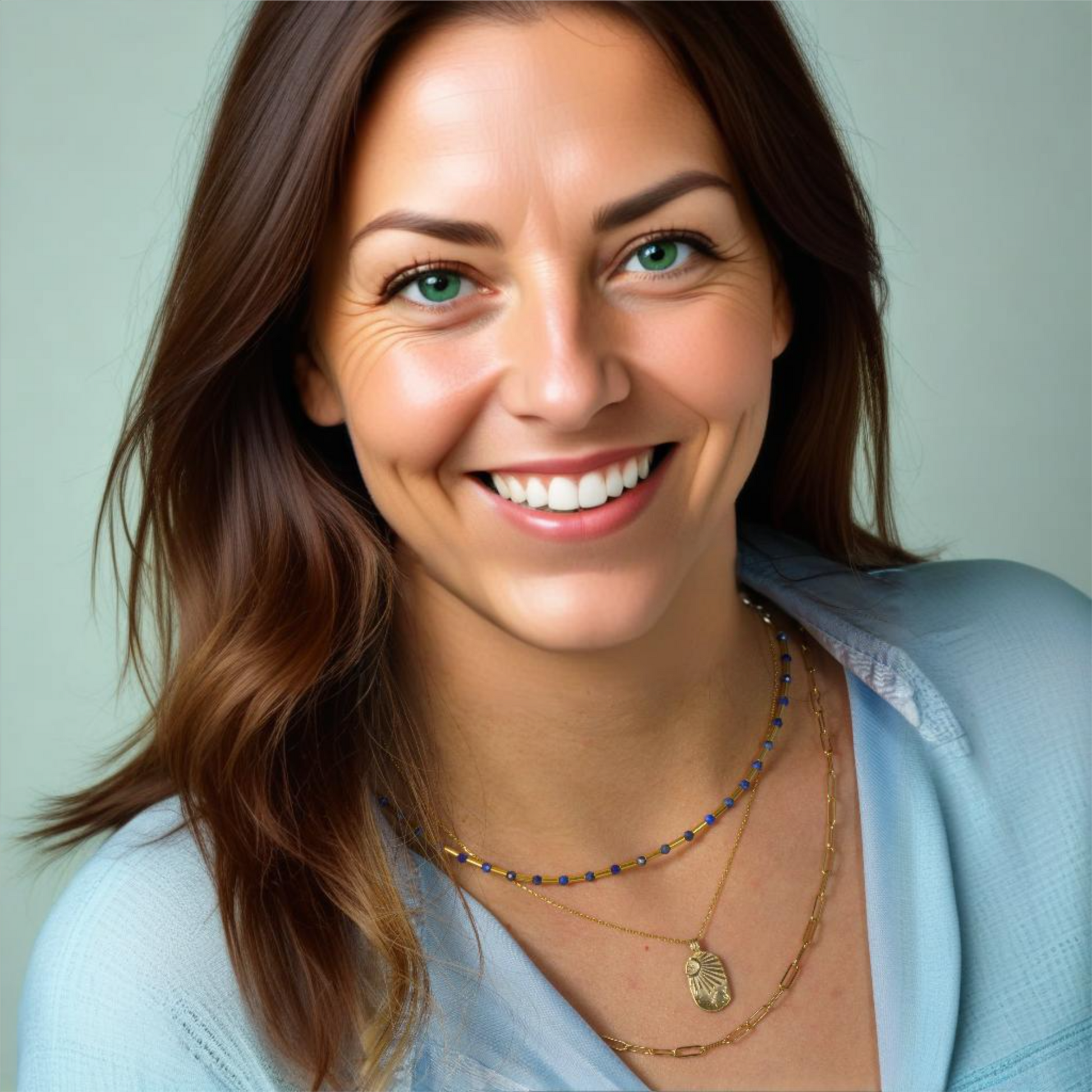 Elegant woman wearing Lapis Lazuli gemstone and silver pipe necklace, adding style and charm to any outfit.