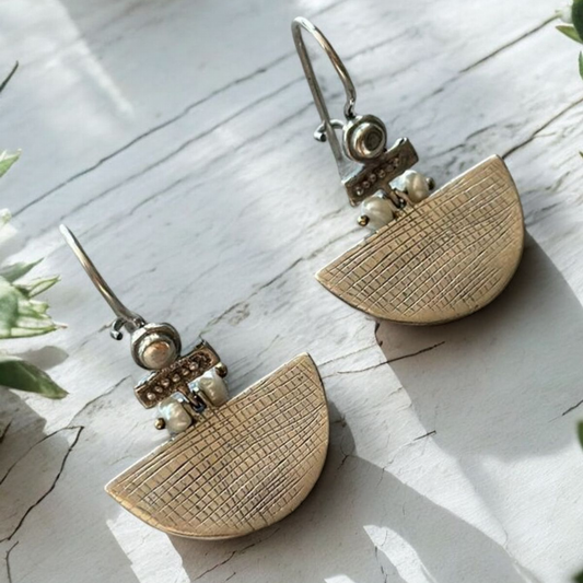 Elegant Selena Silver Earrings with textured half-circle design and pearl accents