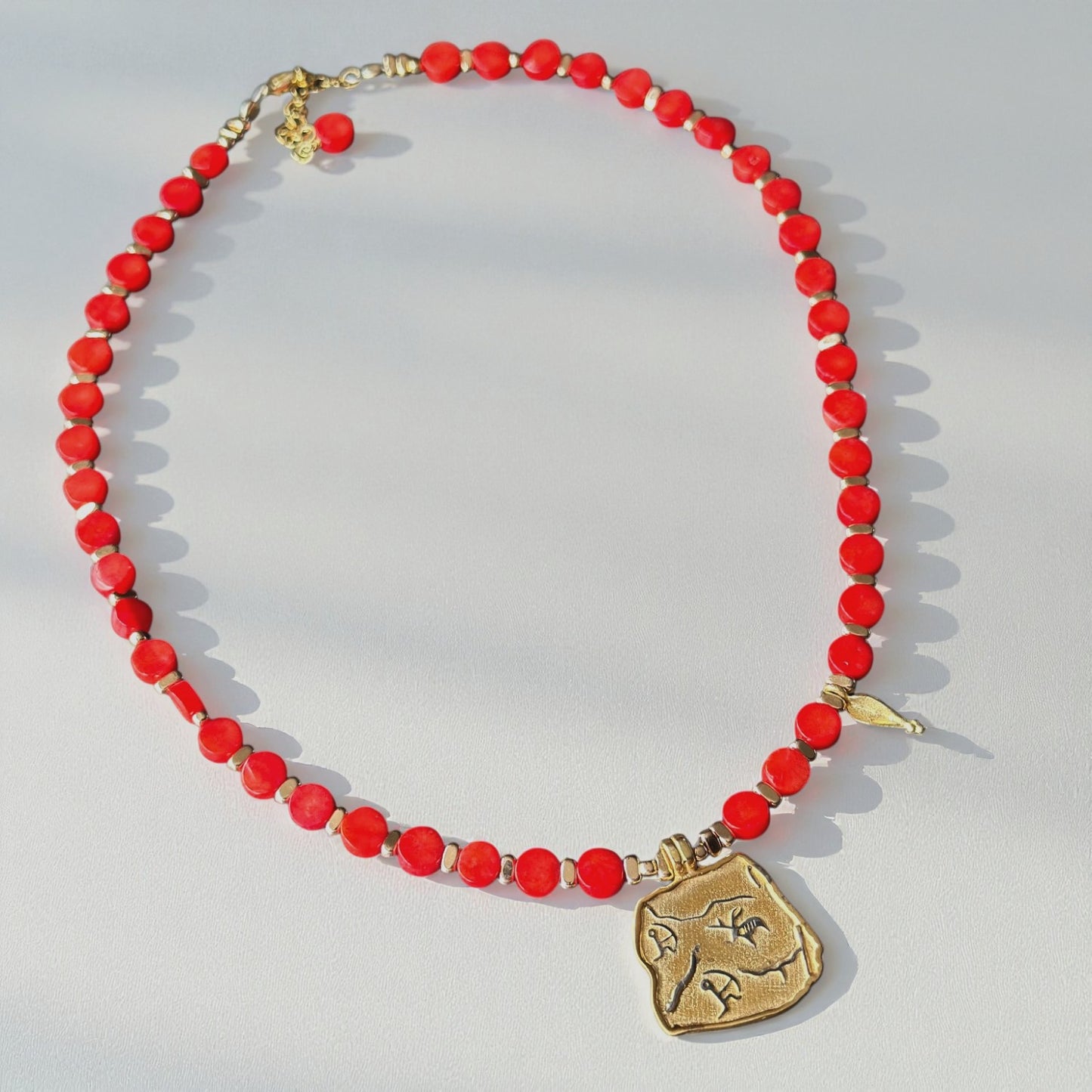 Red Coral Necklace with Gold-Plated Ancient Symbol Pendant