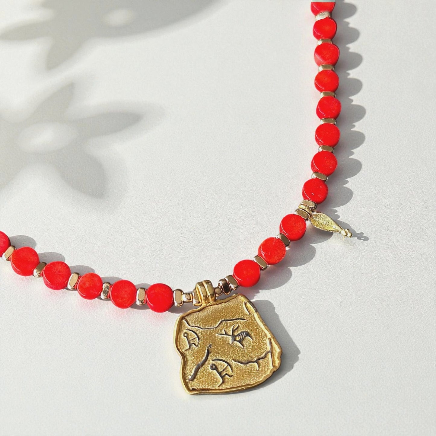Red Coral Necklace with Gold-Plated Ancient Symbol Pendant