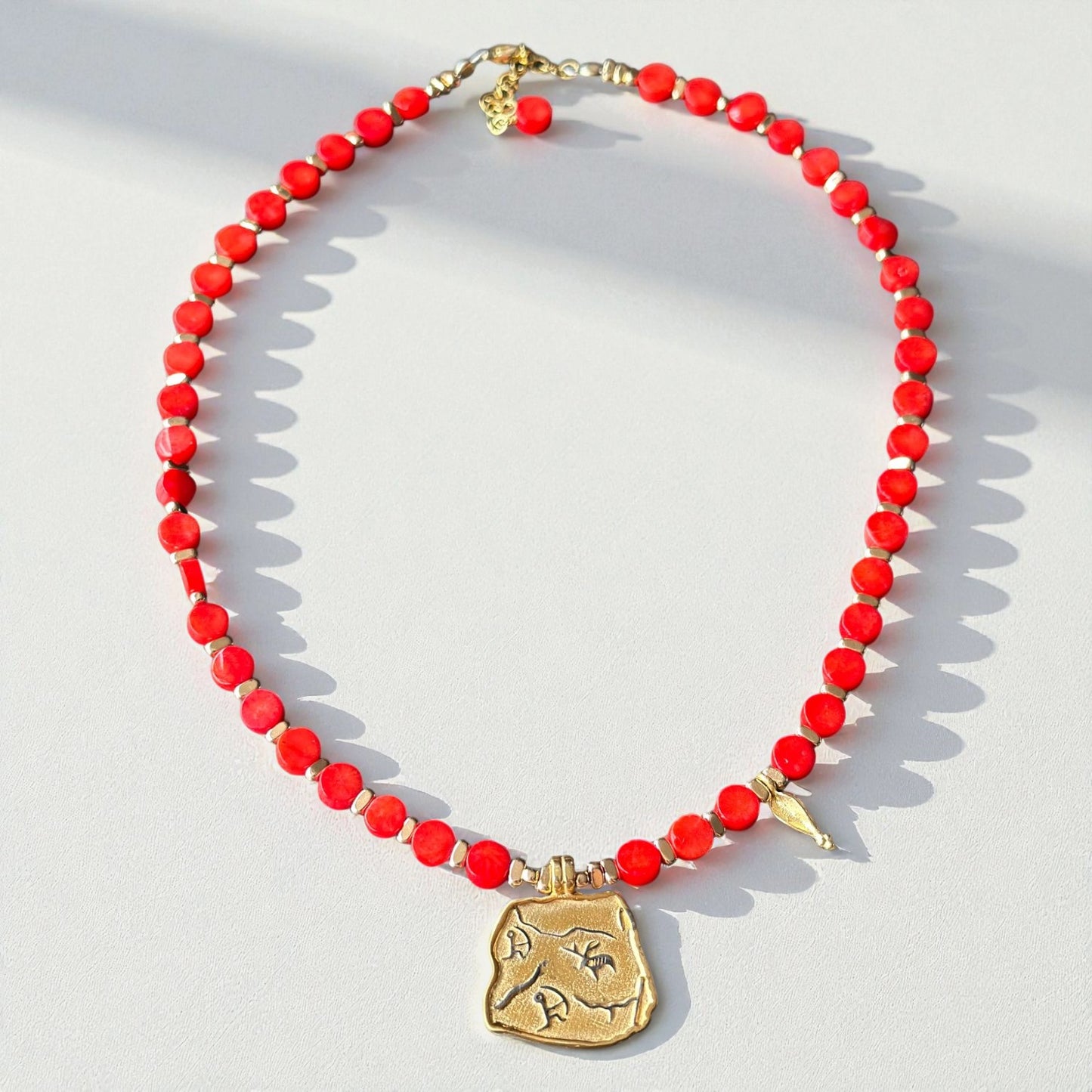 Red Coral Necklace with Gold-Plated Ancient Symbol Pendant